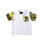 “Children’s white t-shirt with green African wax print sleeves and pocket — front view”